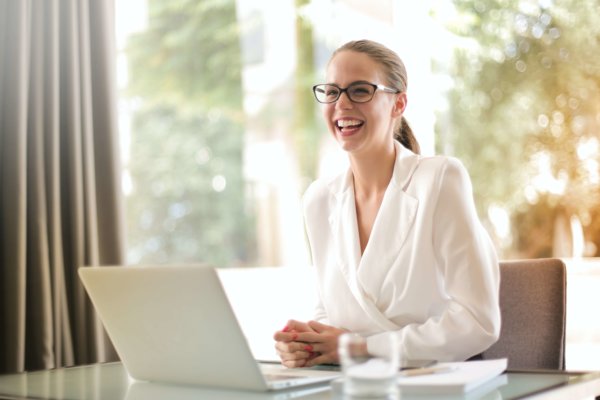 Happy Employee Sitting On Work Station