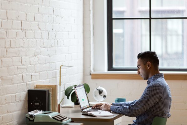 Man Working On A Desktop