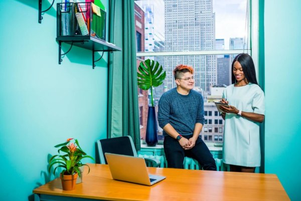 man and woman by a window